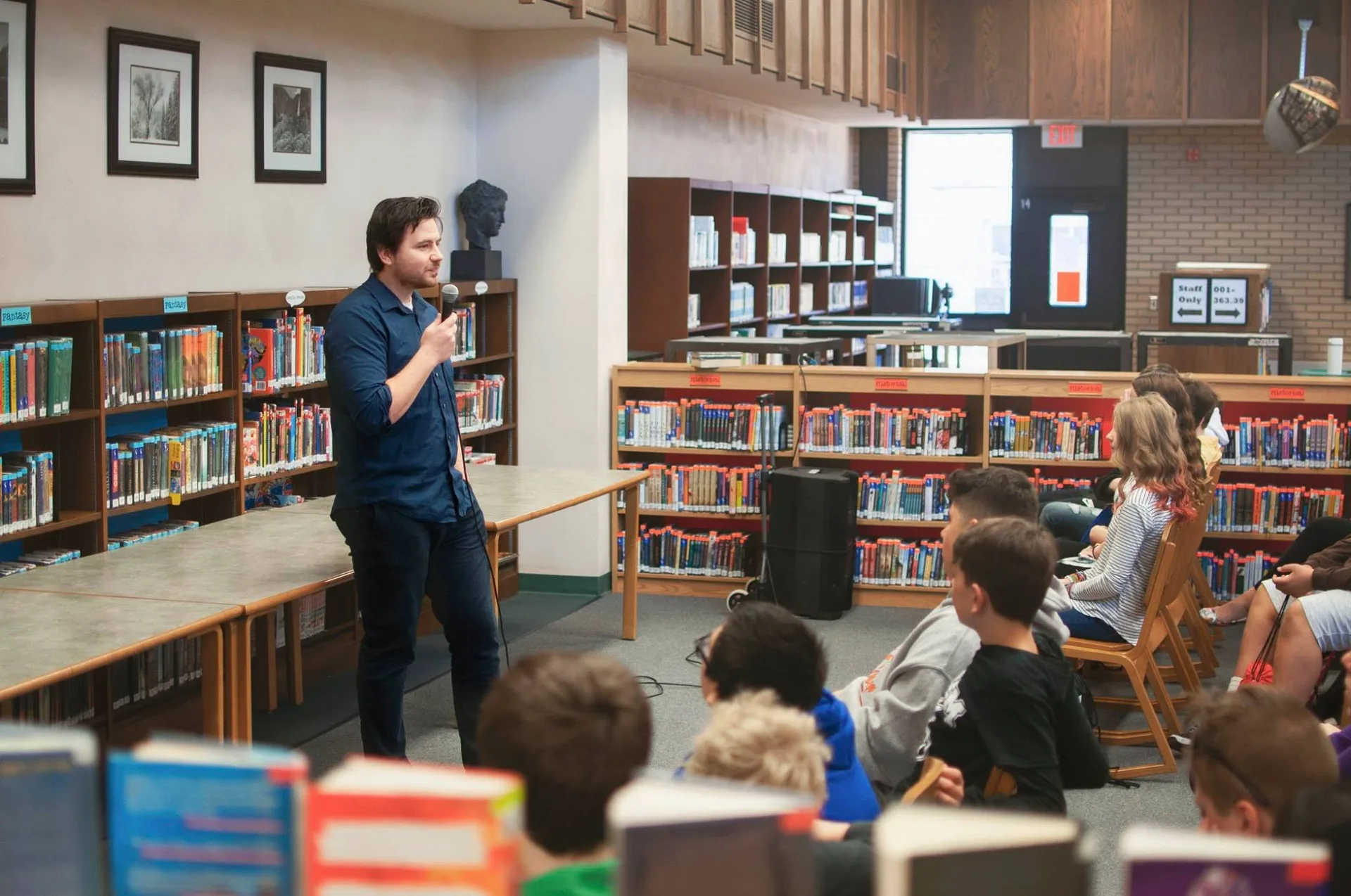 Speaking to students in a school library